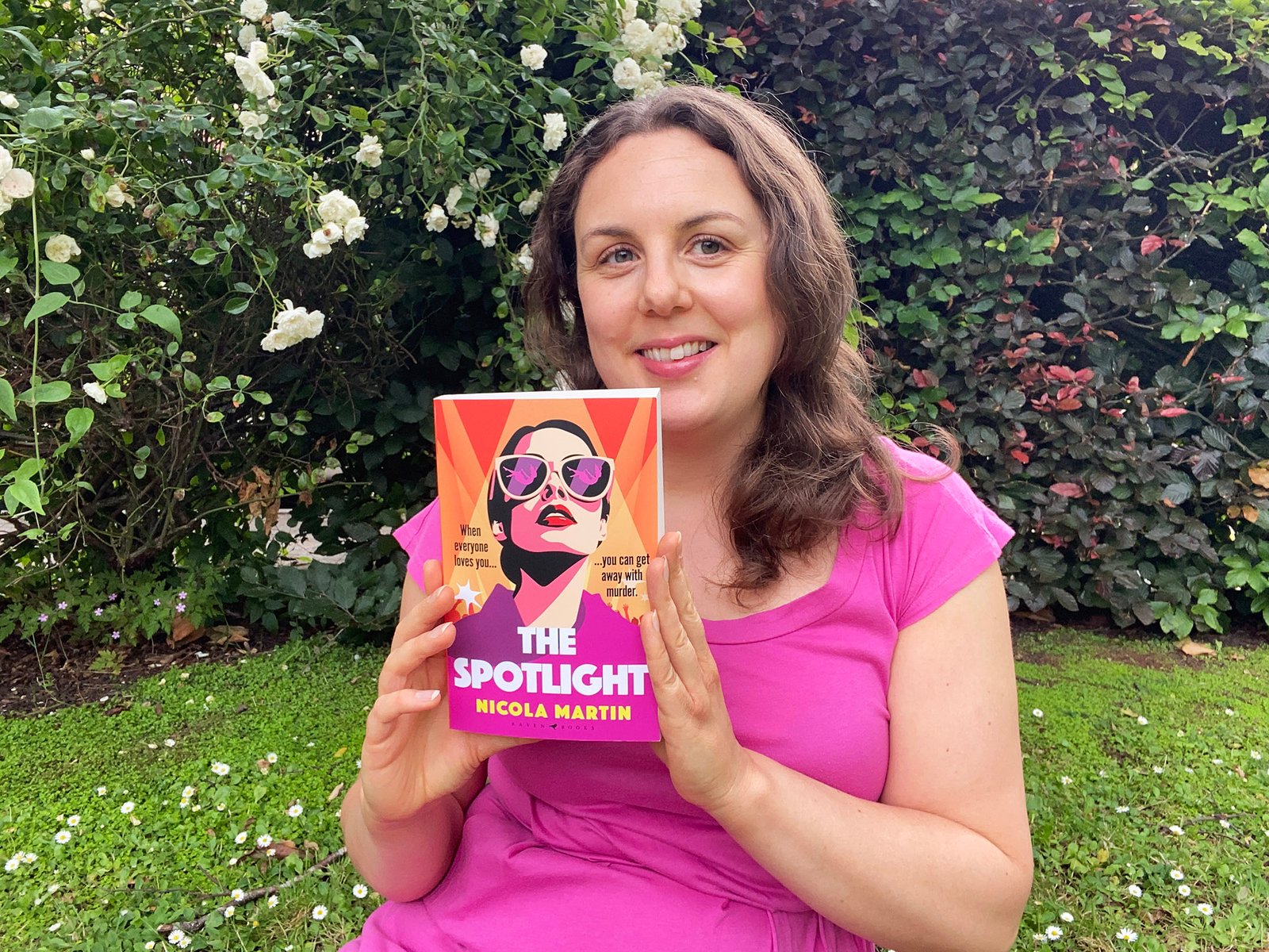 Nicola Martin holding a copy of The Spotlight