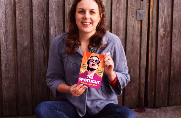 Nicola Martin holds a copy of The Spotlight