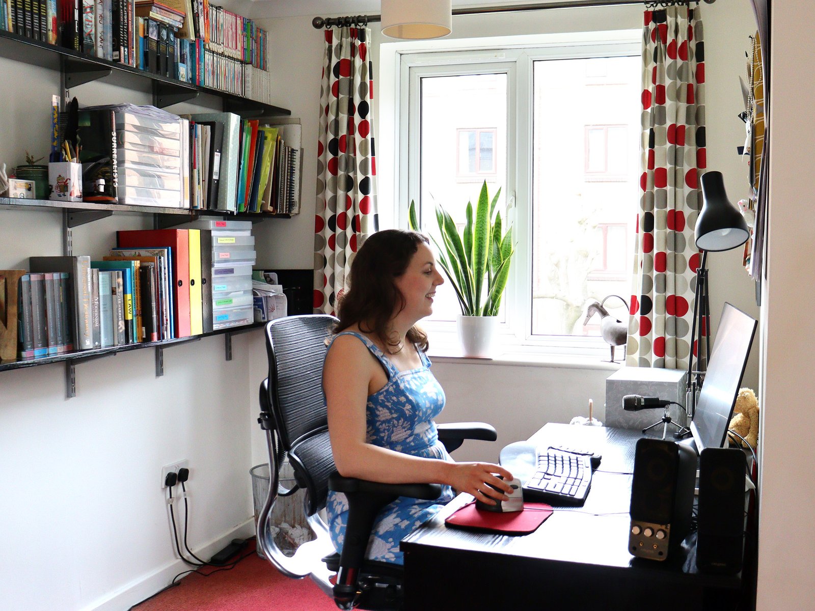 Thriller author Nicola Martin sits at her desk writing